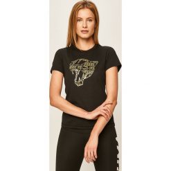 Puma - T-shirt. Czarne bluzki damskie Puma, s, z nadrukiem, z elastanu, casualowe, z okrągłym kołnierzem. Za 129,90 zł.