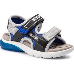 Sandały GEOX - J S.Flexyper B.C J929DC 014BU C0245 D Black/Royal. Szare sandały chłopięce Geox, ze skóry ekologicznej, bez zapięcia. W wyprzedaży za 199,00 zł.