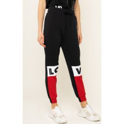 Spodnie dresowe LOVE MOSCHINO W151901M 4068. Czarne spodnie dresowe damskie Love Moschino, m, z bawełny. W wyprzedaży za 479,00 zł.