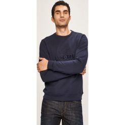 Lacoste - Bluza. Niebieskie bluzy męskie Lacoste, s, bez wzorów, z bawełny, z okrągłym kołnierzem, bez rękawów, bez kaptura. W wyprzedaży za 449,90 zł.