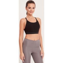 Cardio Bunny - Biustonosz sportowy Manipur. Czarne biustonosze sportowe damskie Cardio Bunny, s, bez wzorów, z elastanu. W wyprzedaży za 99,90 zł.