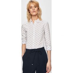 Tommy Hilfiger - Koszula. Białe bluzki damskie TOMMY HILFIGER, bez wzorów, z bawełny, klasyczne, z klasycznym kołnierzykiem, z długim rękawem. W wyprzedaży za 329,90 zł.