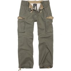 Brandit Heavy Weight Trouser Spodnie oliwkowy. Zielone spodnie męskie marki Brandit, xl, z aplikacjami, vintage, długie. Za 199,90 zł.