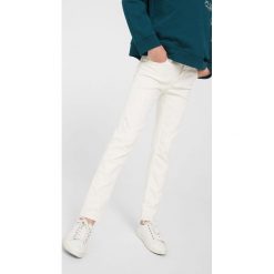 Mango Kids - Jeansy dziecięce Petra 110-164 cm. Białe jeansy dziewczęce marki Mango Kids, z bawełny. W wyprzedaży za 39,90 zł.