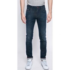 Tommy Hilfiger - Jeansy. Niebieskie jeansy męskie marki TOMMY HILFIGER. W wyprzedaży za 319,90 zł.