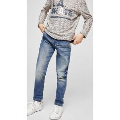 Mango Kids - Jeansy dziecięce Comfy 104-164 cm. Niebieskie jeansy męskie marki Mango Kids, z elastanu. W wyprzedaży za 69,90 zł.