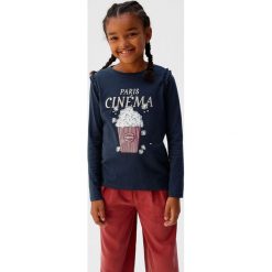 Mango Kids - Longsleeve dziecięcy Cinema 110-164 cm. Niebieskie bluzki dziewczęce Mango Kids, z nadrukiem, z bawełny, z okrągłym kołnierzem, z krótkim rękawem, krótkie, bez kaptura. Za 59,90 zł.
