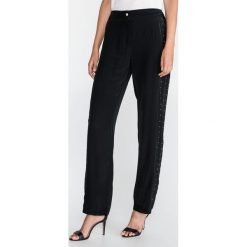 Just Cavalli Spodnie Czarny. Czarne spodnie damskie Just Cavalli, m, z wiskozy. Za 1756,95 zł.