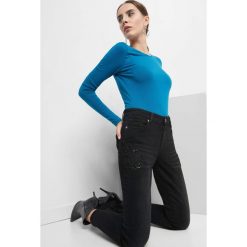 Jeansy skinny z koralikami. Czarne jeansy damskie skinny marki Orsay, z aplikacjami, z bawełny. Za 129,99 zł.