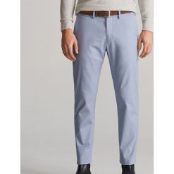 Spodnie chino z paskiem - Niebieski. Niebieskie spodnie damskie Reserved. Za 89,99 zł.