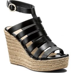 Espadryle UNISA - Muria Black Newman. Czarne espadryle damskie Unisa, bez wzorów, ze skóry, bez obcasa, na obcasie. W wyprzedaży za 299,00 zł.