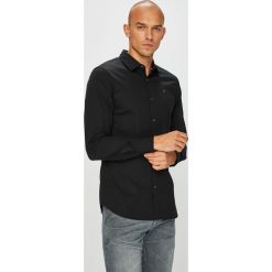 Tommy Jeans - Koszula. Niebieskie koszule męskie marki Tommy Jeans, s, z elastanu, klasyczne, z klasycznym kołnierzykiem, z długim rękawem. Za 269,90 zł.