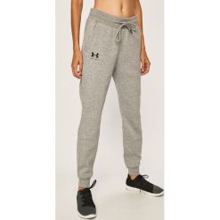 Under Armour - Spodnie. Różowe spodnie damskie Under Armour, s, bez wzorów, z bawełny. Za 179,90 zł.
