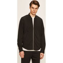 Clean Cut Copenhagen - Kurtka bomber. Czarne płaszcze męskie Clean Cut Copenhagen, s, bez wzorów, z poliesteru, krótkie, bez kaptura. Za 339,90 zł.