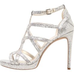 MICHAEL Michael Kors SANDRA PLATFORM Sandały na obcasie champagne. Żółte rzymianki damskie MICHAEL Michael Kors, z materiału, na obcasie. Za 779,00 zł.