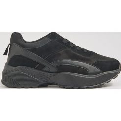 Czarne sportowe buty - Czarny. Czarne buty sportowe damskie Sinsay, bez wzorów, sportowe. Za 79,99 zł.