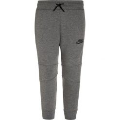 Nike Performance TECH PANT Spodnie treningowe carbon heather/anthracite. Szare spodnie chłopięce Nike Performance, z bawełny. W wyprzedaży za 254,15 zł.