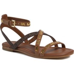 Sandały MICHAEL MICHAEL KORS - Tasha Flat Sandal 40S0TAFA2L Luggage/Brwn. Pomarańczowe klapki damskie MICHAEL Michael Kors, bez wzorów, ze skóry ekologicznej, bez obcasa. Za 579,00 zł.