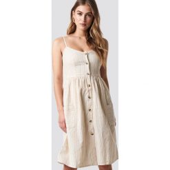 MANGO Sukienka Salvia - Beige. Brązowe sukienki damskie marki Mango, bez wzorów, bez kołnierzyka, bez rękawów. Za 141,95 zł.