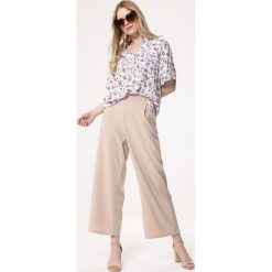 Biała Bluzka Run Chase. Białe bluzki damskie Born2be, xl, z aplikacjami. Za 79,99 zł.