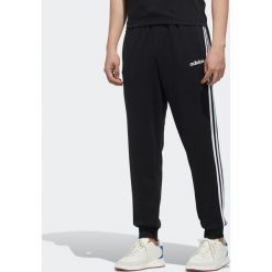 Spodnie dresowe Gym & Pilates męskie. Czarne spodnie męskie Adidas, xs, bez wzorów, z bawełny. Za 169,99 zł.