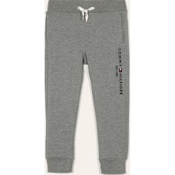 Tommy Hilfiger - Spodnie dziecięce 98-176 cm. Niebieskie dresy chłopięce TOMMY HILFIGER, z aplikacjami, z elastanu. Za 229,90 zł.