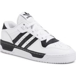 Buty adidas - Rivalry Low W EF6430 Ftwwht/Ftwwht/Cblack. Białe półbuty damskie Adidas, bez wzorów, ze skóry ekologicznej, bez obcasa, na płaskiej podeszwie, bez zapięcia. Za 379,00 zł.