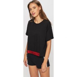 Calvin Klein Jeans - Top plażowy. Czarne stroje kąpielowe damskie Calvin Klein Jeans, xs, bez wzorów, z elastanu. W wyprzedaży za 99,90 zł.