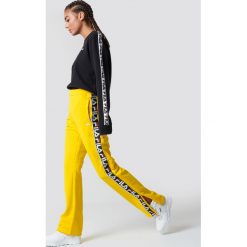 Spodnie damskie: FILA Spodnie Thora Track - Yellow