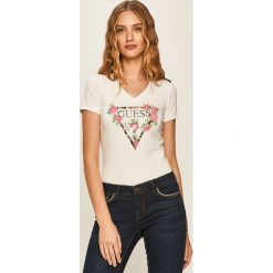 Guess Jeans - T-shirt. Czarne bluzki damskie Guess Jeans, s, z nadrukiem, z elastanu, casualowe, bez kołnierzyka, z krótkim rękawem. Za 199,90 zł.