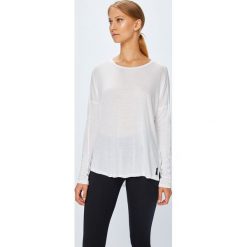 Reebok - Bluzka. Białe topy damskie Reebok, s, bez wzorów, z dzianiny, z okrągłym kołnierzem. W wyprzedaży za 89,90 zł.