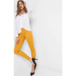 Spodnie skinny. Żółte rurki damskie Orsay, z bawełny, z obniżonym stanem. Za 79,99 zł.