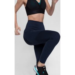 Legginsy treningowe damskie z wysokim stanem 4FPro SPDF408 - granat. Różowe legginsy damskie marki 4f, bez wzorów, z dzianiny. Za 179,99 zł.