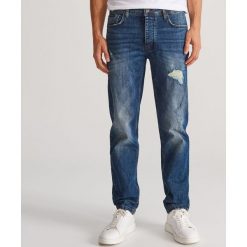 Jeansowe spodnie - Granatowy. Niebieskie spodnie męskie Reserved, m, bez wzorów, z jeansu. Za 149,99 zł.