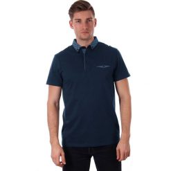 Elegancka Granatowa Koszulka Polo z Kieszonką, Męska z Krótkim Rękawem, Just Yuppi TSJTYUPPOLO9232kol3GRANAT. Niebieskie koszulki męskie Just Yuppi, m, bez wzorów, z tkaniny, eleganckie, z krótkim rękawem. W wyprzedaży za 69,00 zł.