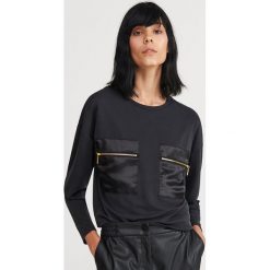 Bluzka z kieszeniami - Czarny. Czarne bluzki damskie Reserved, s, bez wzorów, bez kołnierzyka, bez rękawów. Za 79,99 zł.
