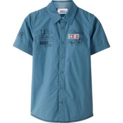 Koszula z krótkim rękawem bonprix niebieski dżins z nadrukiem. Niebieskie koszule chłopięce bonprix, z nadrukiem, eleganckie, z klasycznym kołnierzykiem, z krótkim rękawem, krótkie. Za 49,99 zł.