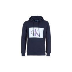 Bluzy Calvin Klein Jeans MONOGRAM BOX LOGO HOODIE. Niebieskie bluzy męskie marki Calvin Klein Jeans, xl, bez wzorów, z jeansu, bez kołnierzyka, bez rękawów, bez kaptura. Za 391,20 zł.