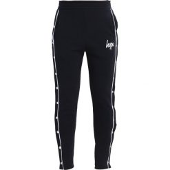 Spodnie dresowe damskie: Hype JOGGERS POPPER Spodnie treningowe navy/white