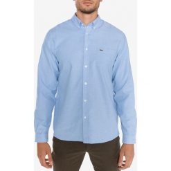 Lacoste Koszula Niebieski. Niebieskie koszule męskie Lacoste, l, bez wzorów, z bawełny, bez kołnierzyka, z długim rękawem. Za 404,95 zł.