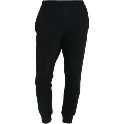 Lacoste Sport Spodnie treningowe black. Czarne spodnie męskie marki Lacoste Sport, xl, bez wzorów, z bawełny, sportowe, długie. Za 369,00 zł.