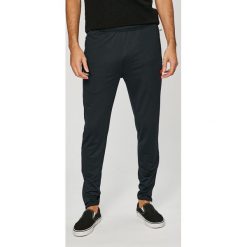 Ellesse - Spodnie. Niebieskie spodnie męskie marki Ellesse, na co dzień, s, bez wzorów, z elastanu, casualowe. Za 149,90 zł.