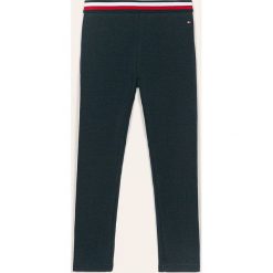 Tommy Hilfiger - Legginsy dziecięce 74-176 cm. Niebieskie spodnie dziewczęce TOMMY HILFIGER, bez wzorów, z elastanu. Za 89,90 zł.