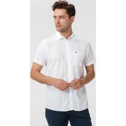 Tommy Jeans Koszula Biały. Białe koszule męskie Tommy Jeans, s, bez wzorów, z bawełny, bez kołnierzyka, z krótkim rękawem. Za 307,95 zł.