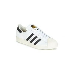 Buty adidas SUPERSTAR 80S. Białe trampki męskie Adidas, bez wzorów, bez zapięcia. Za 383,20 zł.