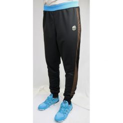 Adidas Rita Ora Loose S11806. Czarne spodnie damskie Adidas, s, z materiału. W wyprzedaży za 99,99 zł.
