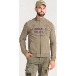 BLUZA Aeronautica Militare. Zielone bluzy męskie Aeronautica Militare, s, z nadrukiem, z bawełny, bez kołnierzyka, bez rękawów, bez kaptura. Za 569,00 zł.