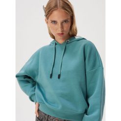 Gładka bluza z kapturem - Turkusowy. Niebieskie bluzy damskie Sinsay, s. W wyprzedaży za 29,99 zł.
