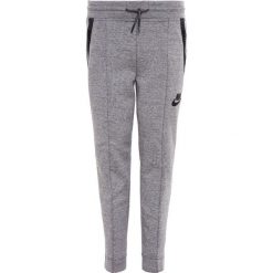 Nike Performance Spodnie treningowe carbon heather/dark grey. Szare spodnie chłopięce marki Nike Performance, z bawełny. W wyprzedaży za 209,30 zł.