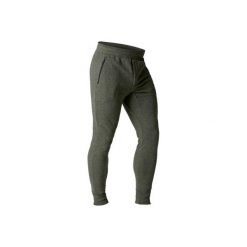 Spodnie skinny Gym & Pilates 500 męskie. Brązowe spodnie męskie DOMYOS, m, bez wzorów, z elastanu. W wyprzedaży za 49,99 zł.